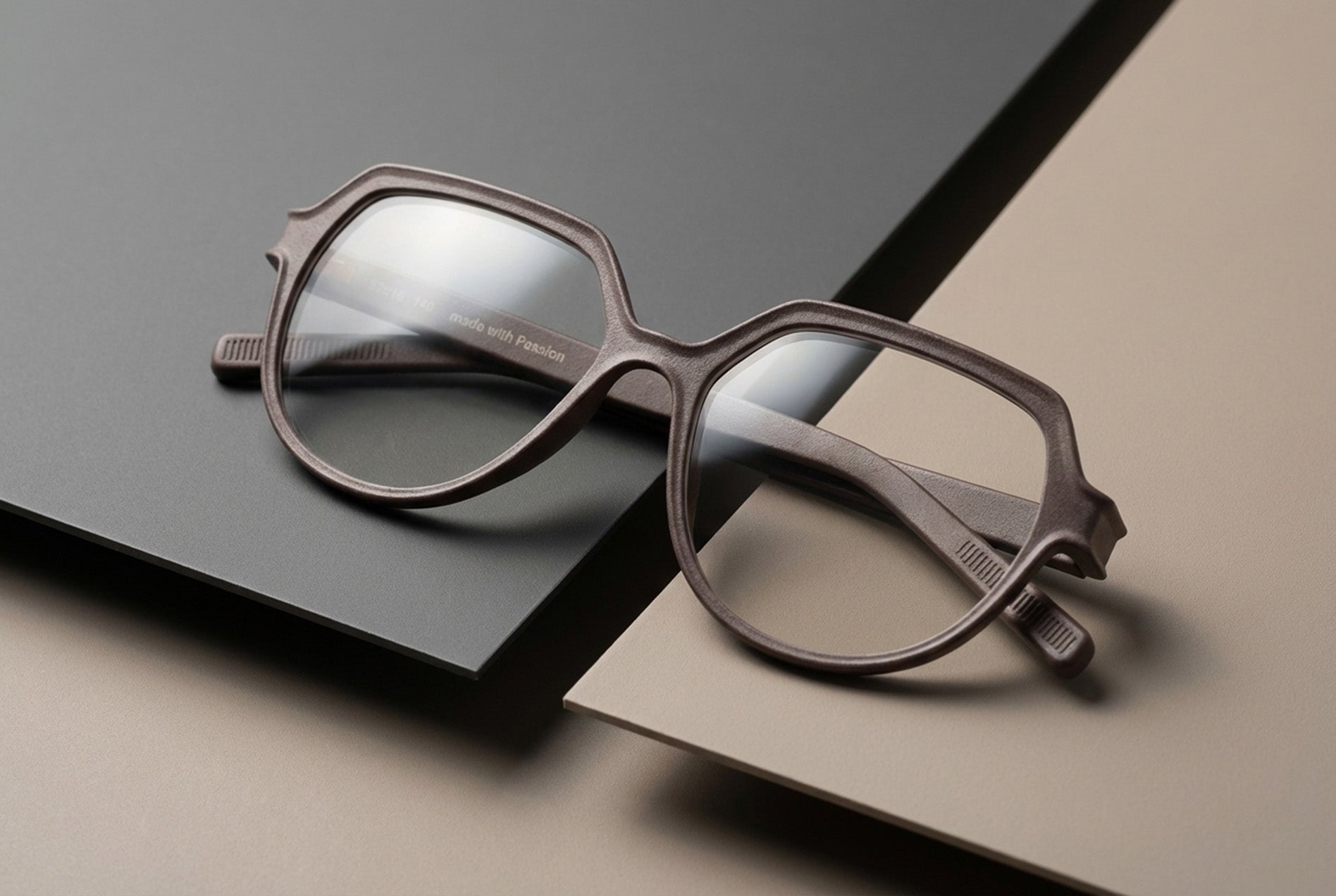 eyewear frame prototype photographed in studio environment showing material and design details
