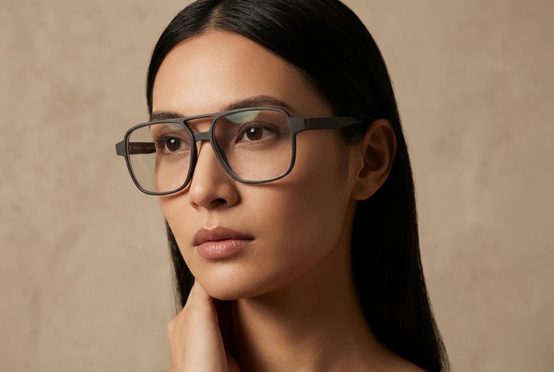 editorial portrait of woman wearing modern optical eyewear frame design
