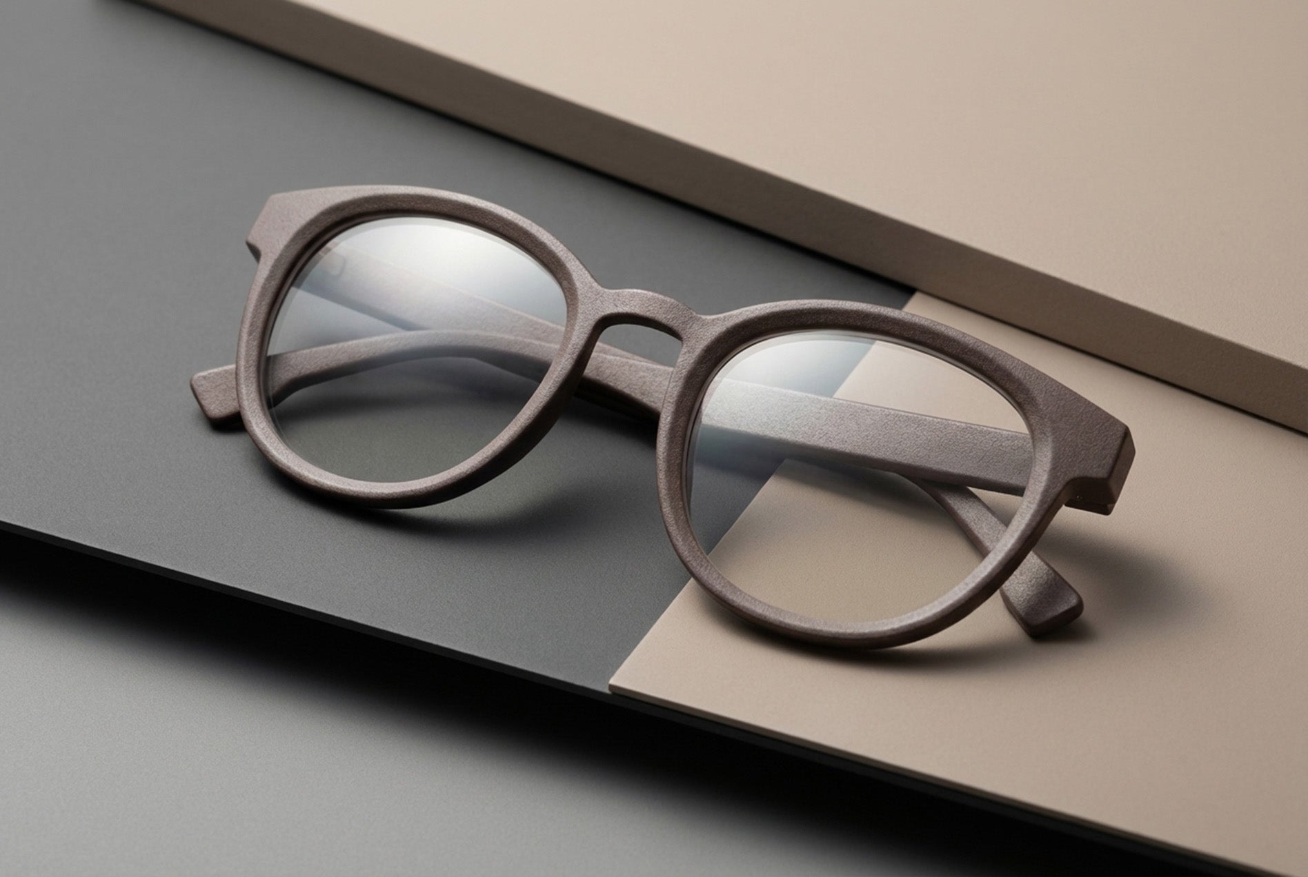 editorial product image of modern optical frame concept placed on neutral studio materials
